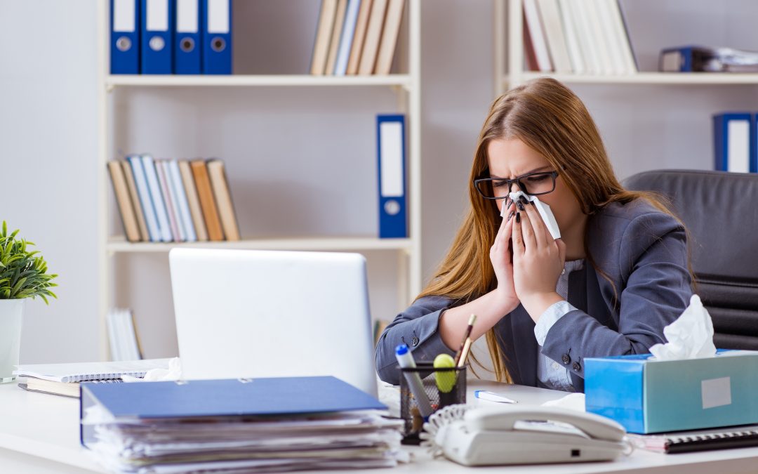 usinesswoman employee sick with flu in the office